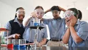 4 Kids in the Curro Lab with an experiment, at Langebaan Curro school.