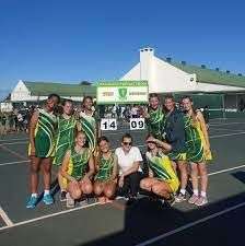 Long Acres school netball team on the court, standing together for a picture in Langebaan