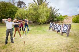 Love weskus ilove weskus iguests trying to master the skill of archery at thai thali game lodge. Aiming with bow to shoot at target.