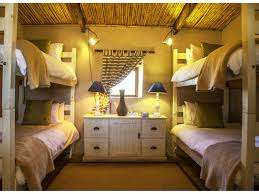 Love weskus ilove weskus ithe inside of the bunker room of the chalets at thali-thali game lodge in the evening providing sleeping for 4.