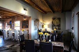Love weskus ilove weskus ithis picture show the interior of the farmhouse of thal thali game lodge with dining room table, chairs and other interior furniture
