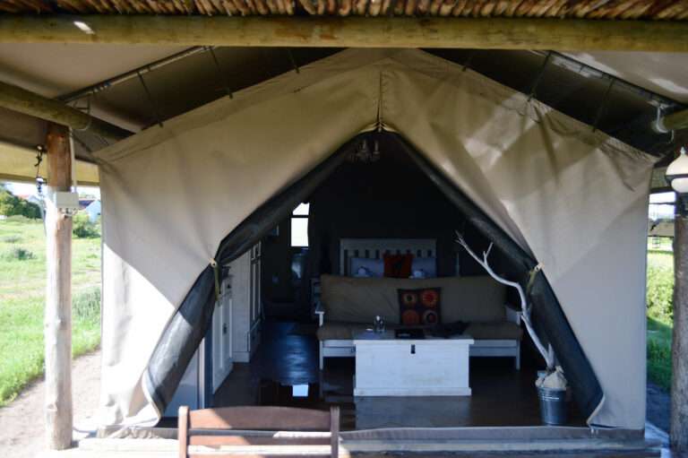 Love weskus ilove weskus iclose up view of the entrance to the tent accommodation, showing interior at the glamping options at thali-thali game lodge