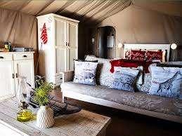 Love weskus ilove weskus ianother view of the interior of the glamping tents at thali thali game lodge, showing bed, sitting area and storage cupboard