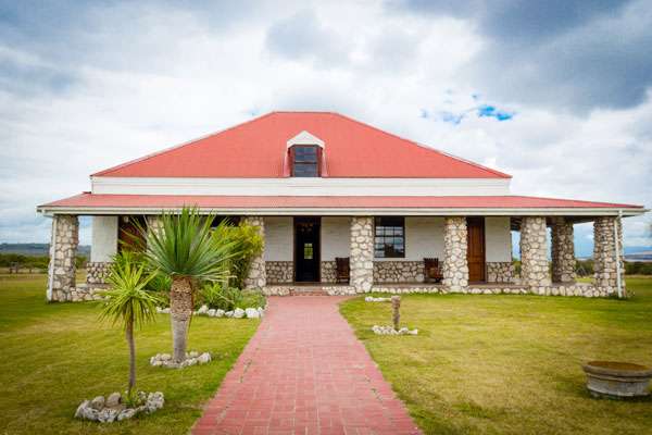 Love weskus ilove weskus ithe front view of the historical farmhouse at thali thali game lodge which is available for self-catering accommodation at langebaan game lodges