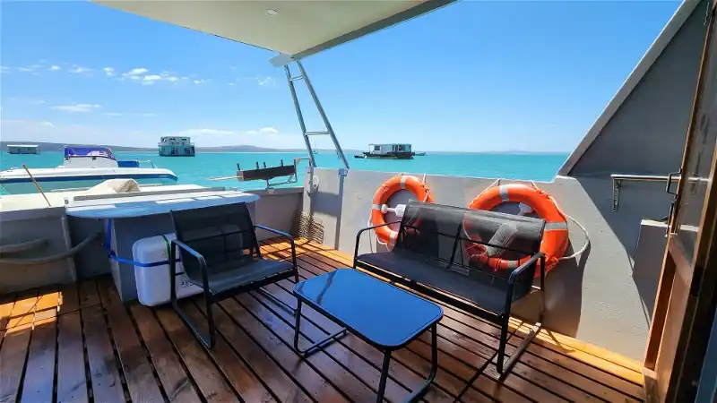 The front view of the Eden Boat House on the Langebaan Lagoon with another boat House in a distance.