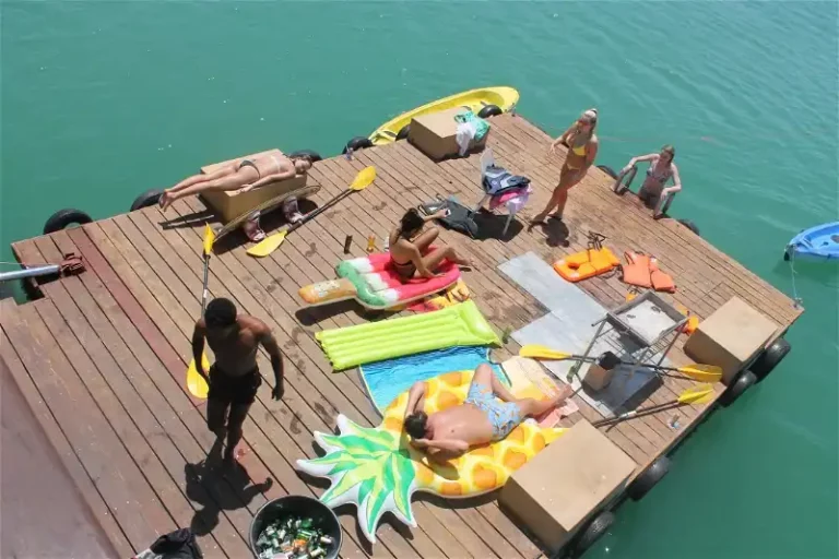 Iigroup of friends enjoy outdoor deck , tanning and leisure on the boat houses in langebaan