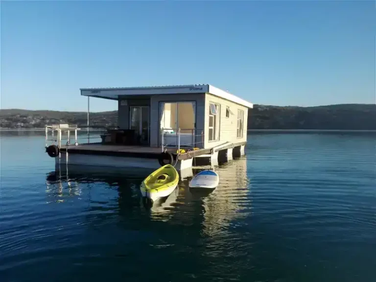 Iithe view towards the serenity boat house in langebaan on the flat waters of the lagoon