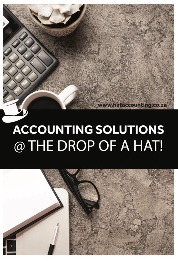 Promotional banner for Accounting Solutions featuring a desk with a calculator, coffee, notebook, glasses and pen, and the slogan “ACCOUNTING SOLUTIONS @ THE DROP OF A HAT.”