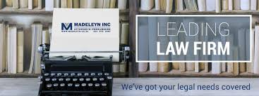 Advertising banner for a leading law firm beside a vintage typewriter and shelves of law books.