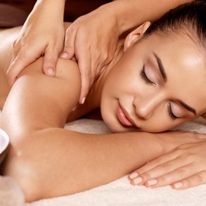 Windtown-langebaan-south-africa-spa-02-299x299 – – Iirelaxed woman lying face down as a massage therapist kneads her shoulder and upper back.